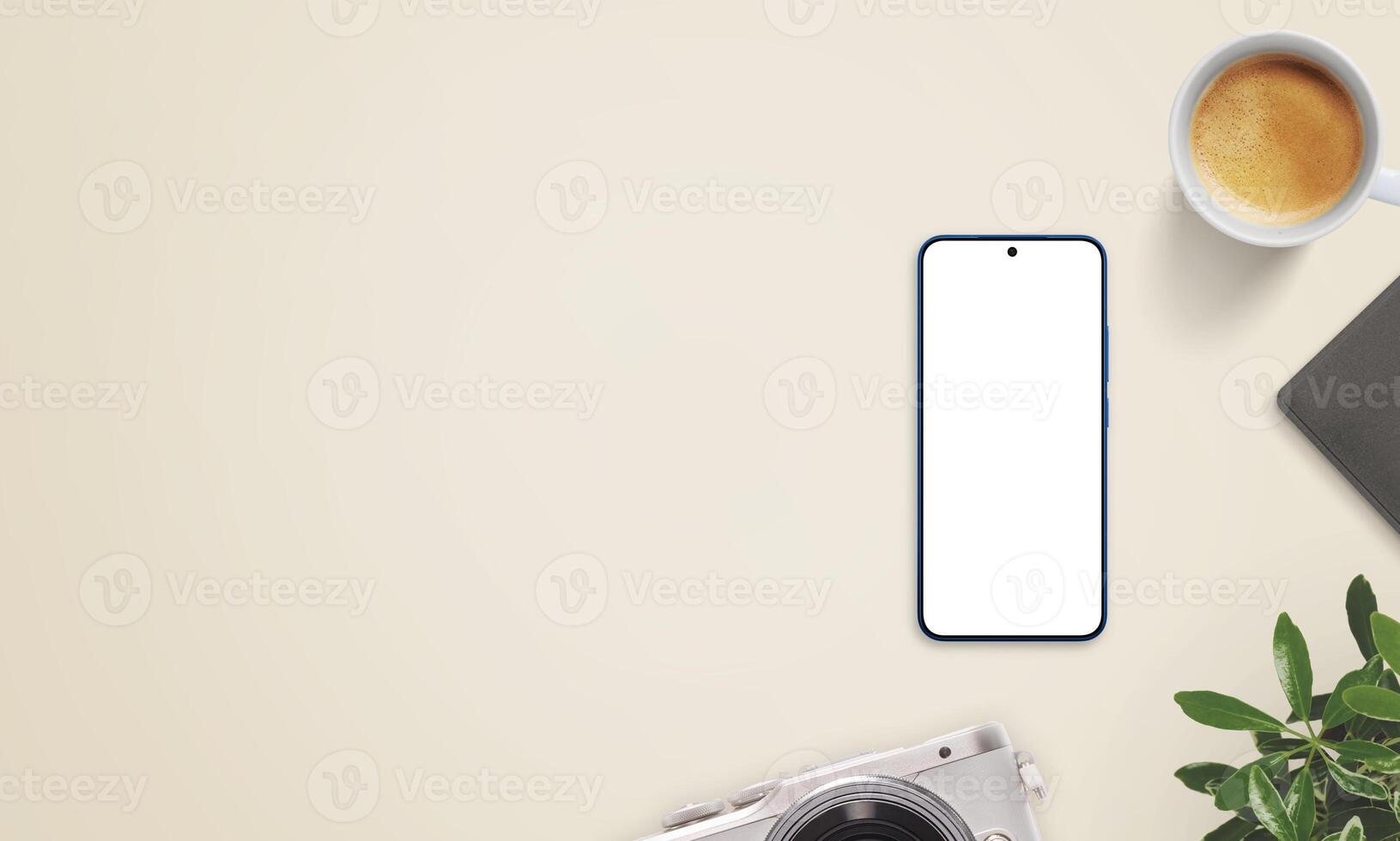 Smartphone mockup on beige desk with large empty space on left for promo text. Surrounded by coffee, camera, notebook, and plant photo