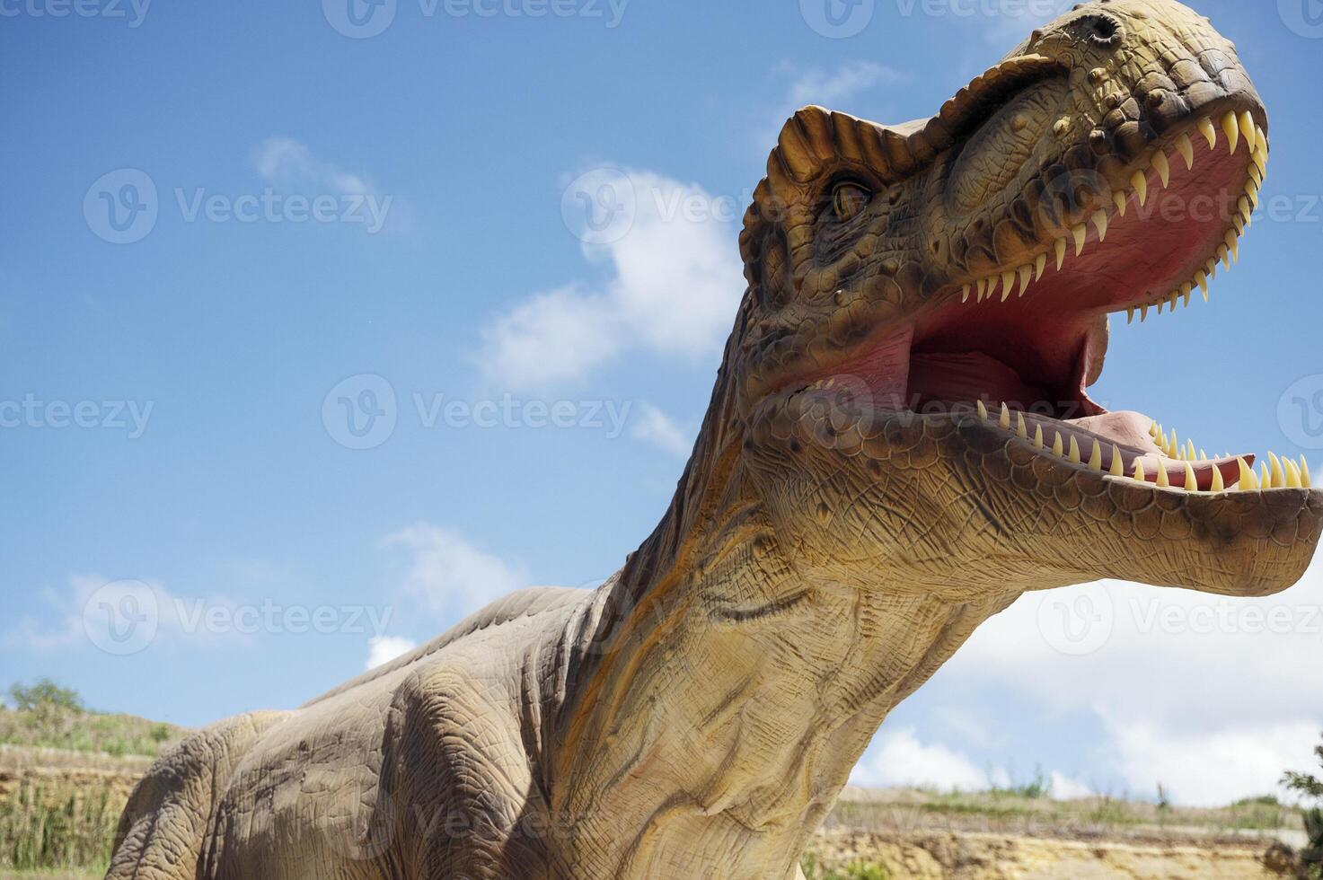 A dinosaur with its mouth open photo