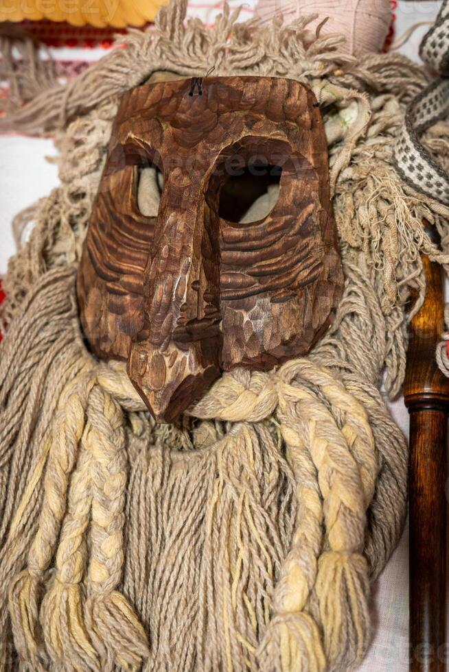 Intricate Wooden Mask with Braided Yarn Details photo