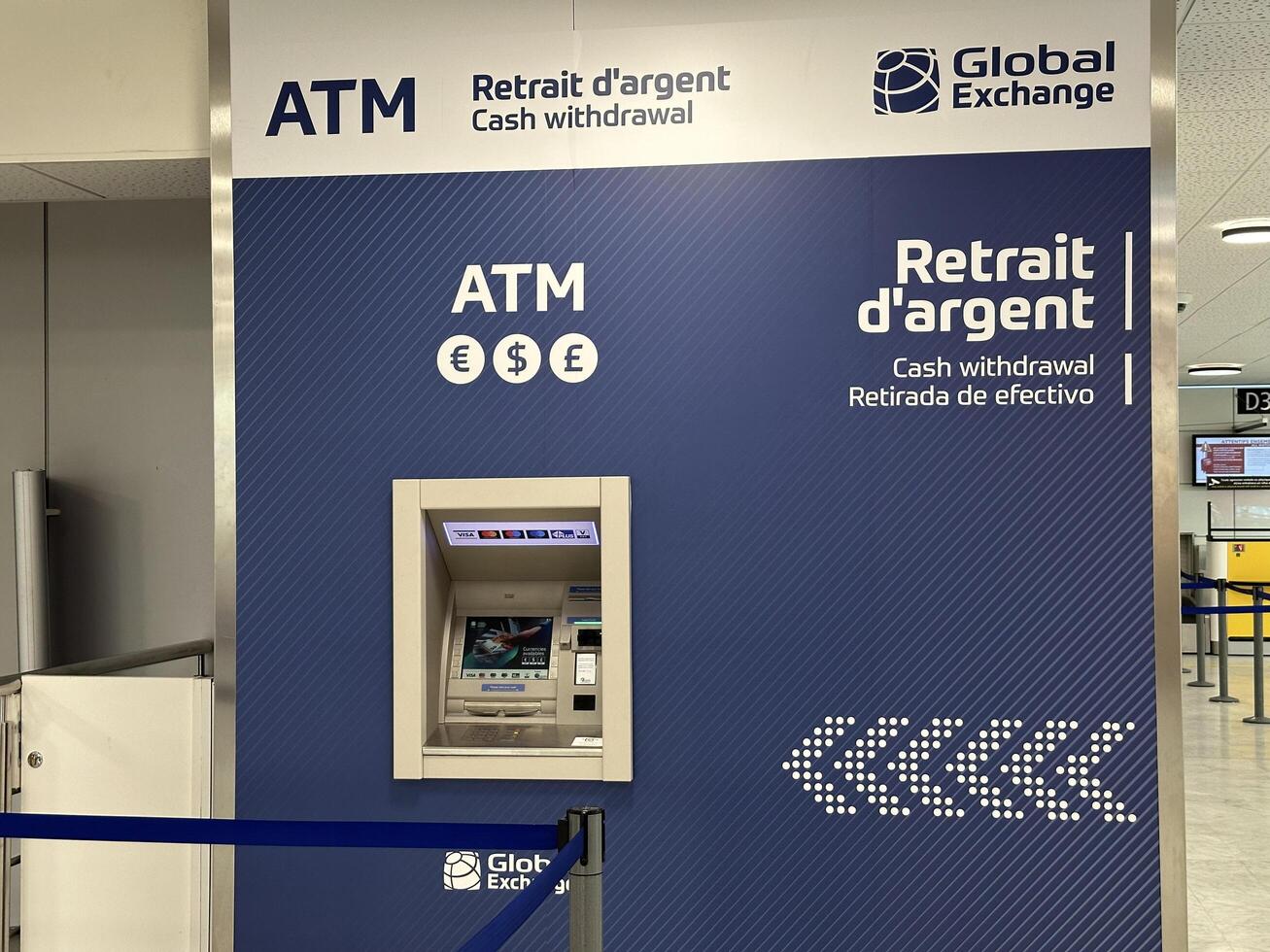 Nice, France - May 10, 2025 ATM machine at Global Exchange location, featuring cash withdrawal services and multilingual signage, providing convenience for travelers in busy airport environment photo