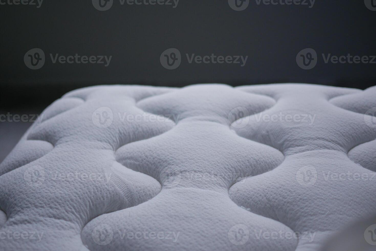 Comfortable white mattress close up in soft light photo
