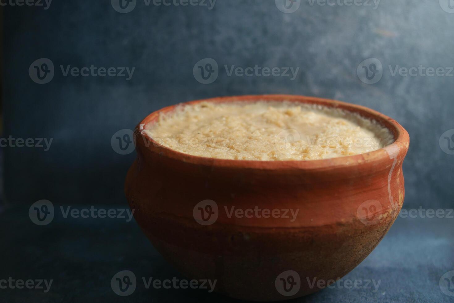 Creamy rice pudding served in traditional clay pot photo