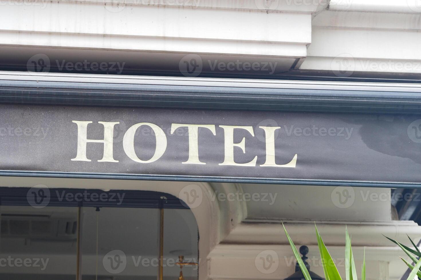 Hotel sign captures urban charm in a busy city area photo