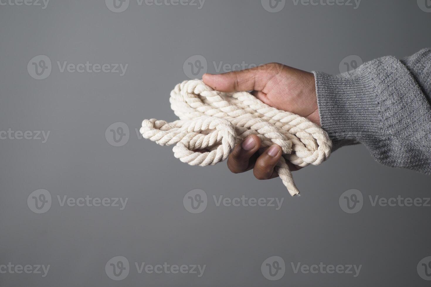 Holding a soft rope in a casual setting photo