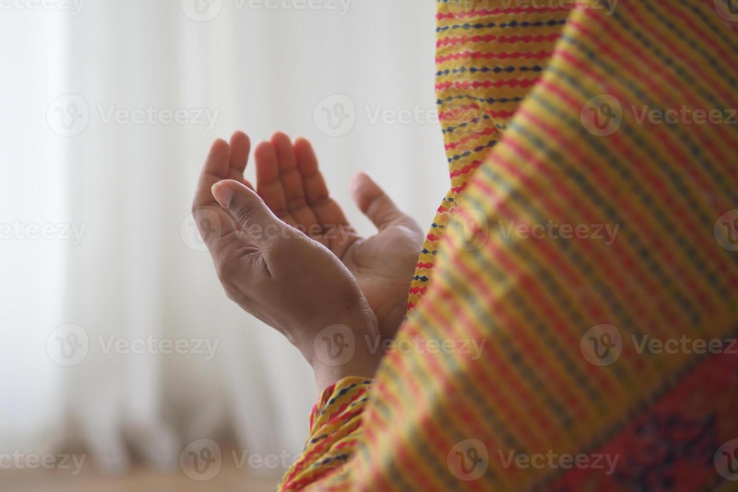 Hands raised in prayer during a spiritual reflection moment photo