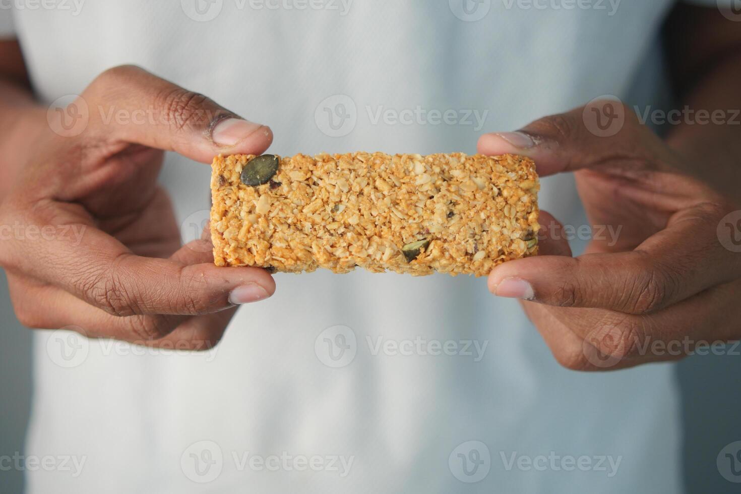A person holds a homemade granola bar photo