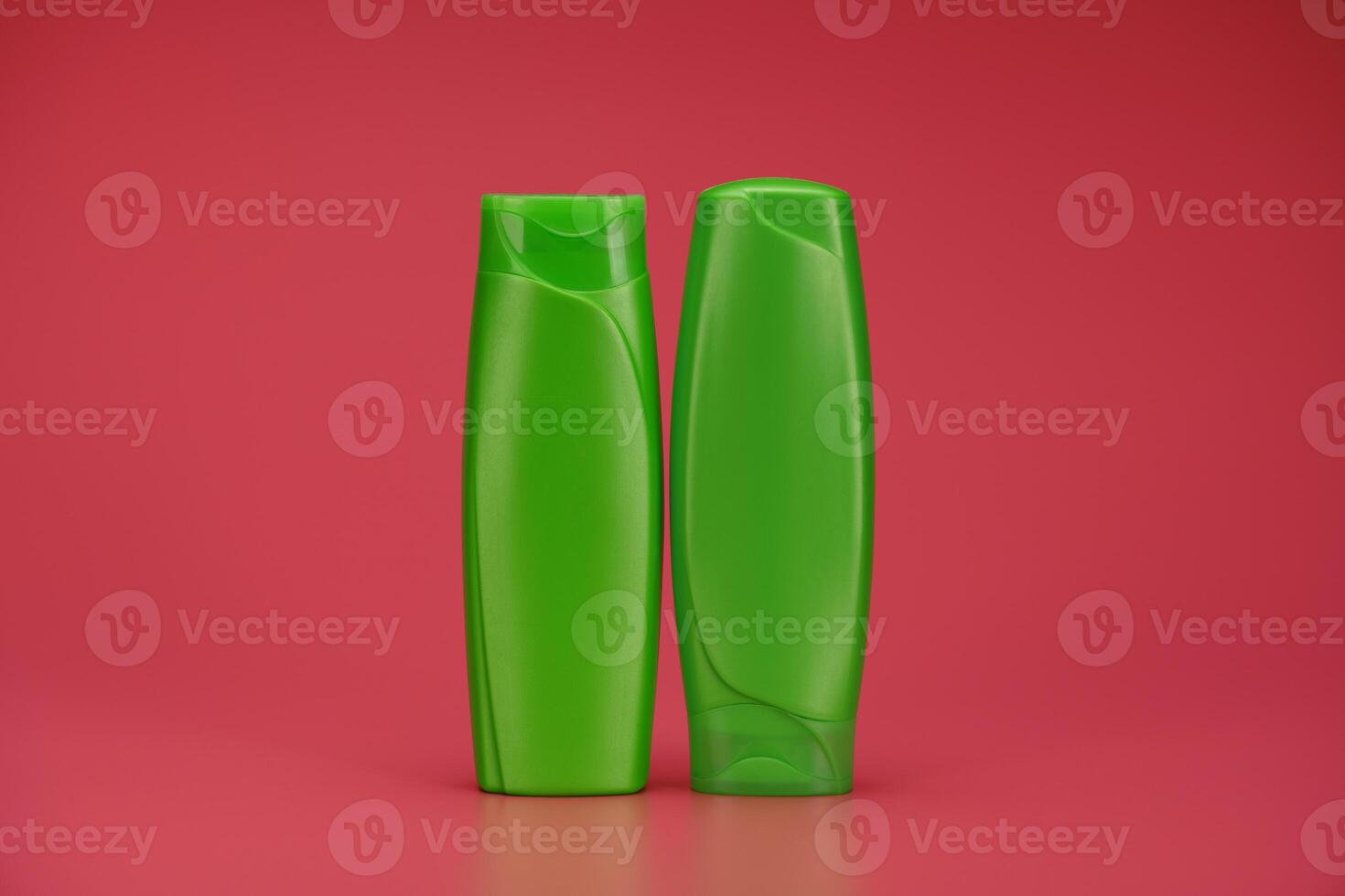 Two Green Blank Label Shampoo Bottle or Shower Gel on Pink Background photo