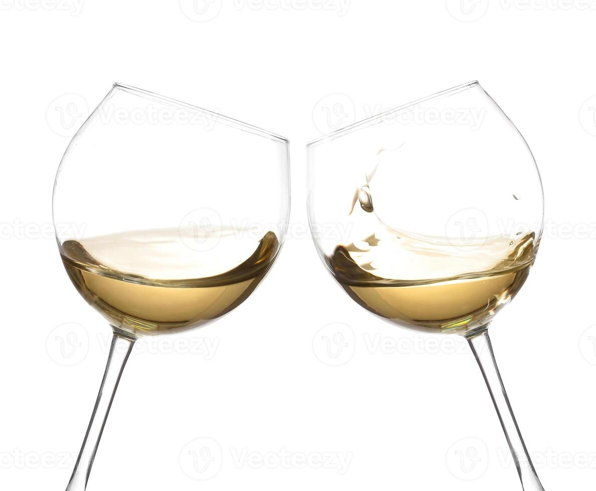 Two wine glasses with white wine in them, cheers photo