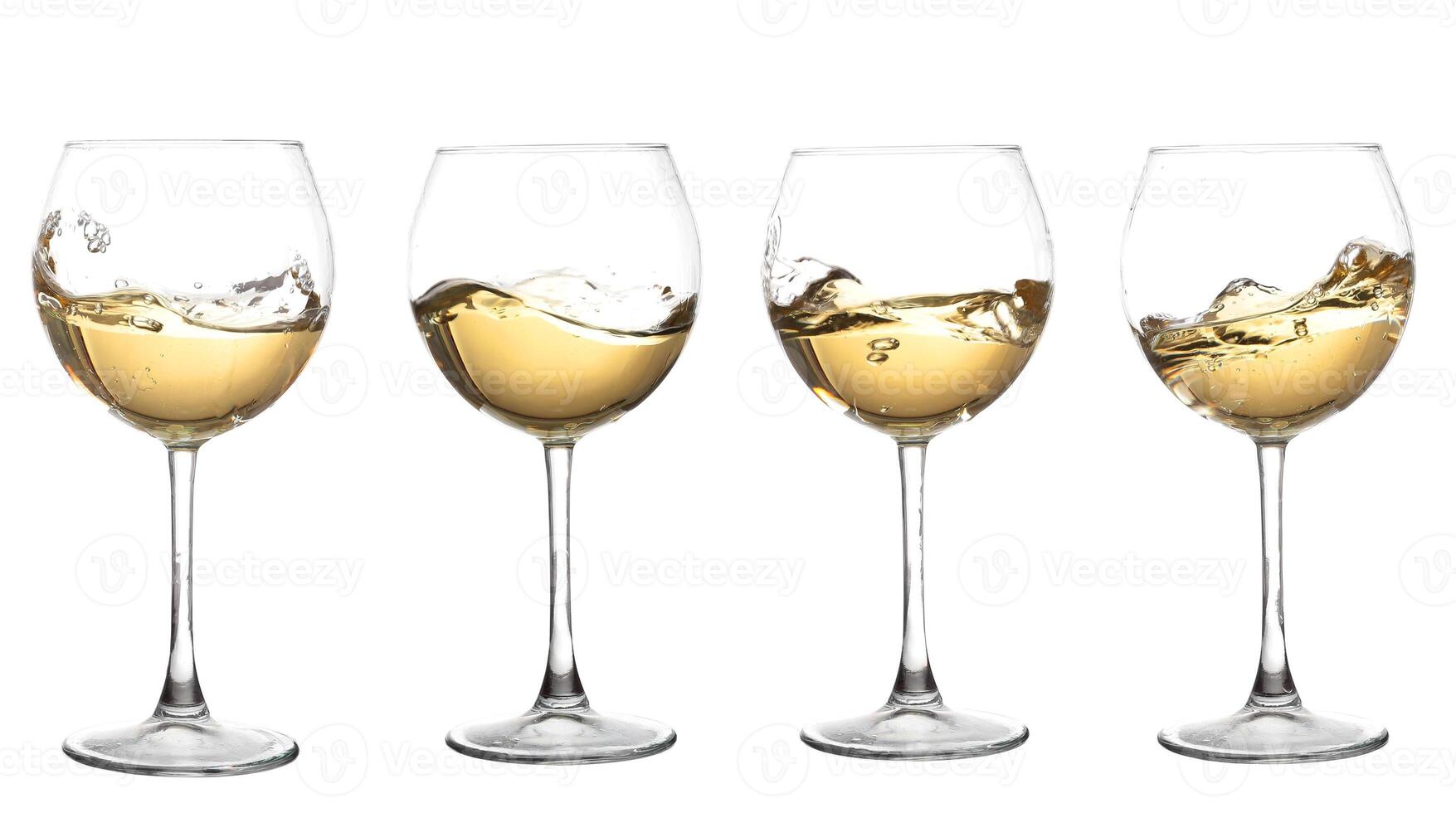Four wine glasses with liquid in them photo