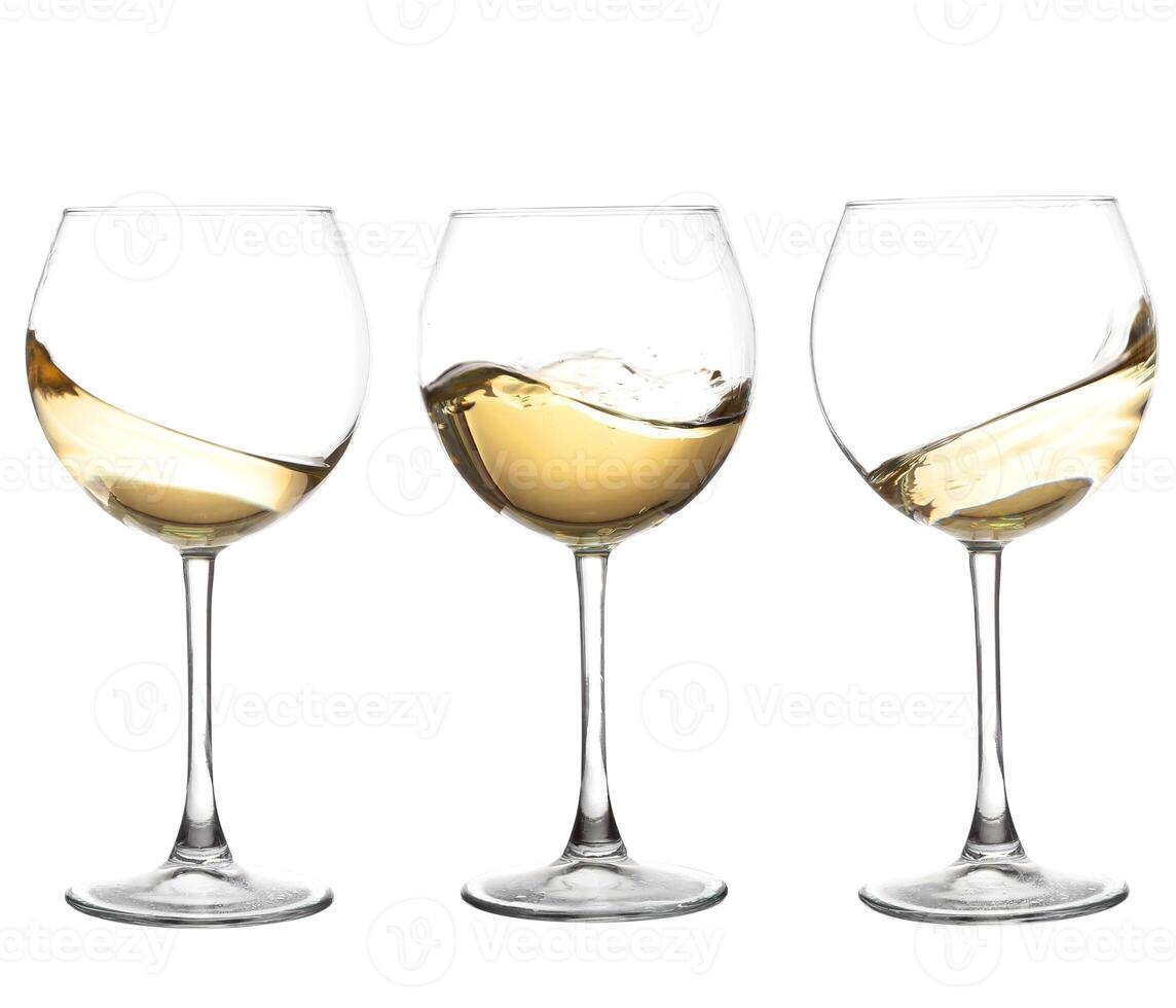 Three wine glasses with white wine in them photo