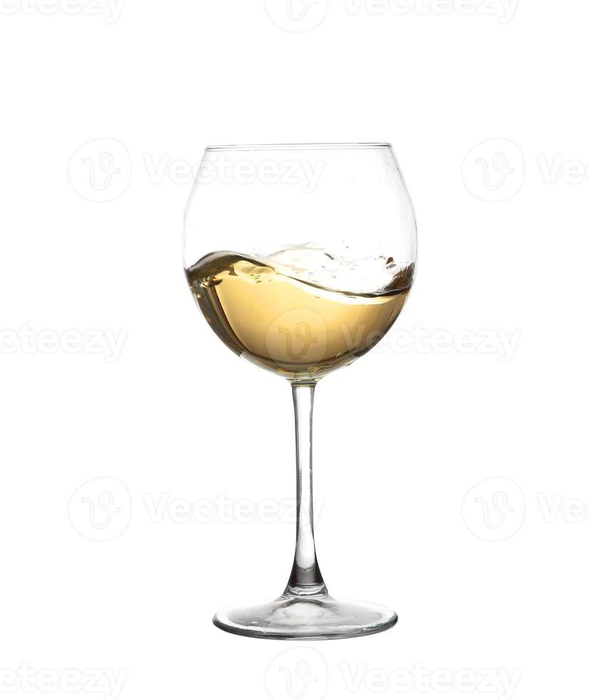 A wine glass with a white liquid in it photo