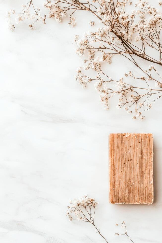 Natural Soap Bar with Dried Flowers on White Marble for Zero Waste Living photo