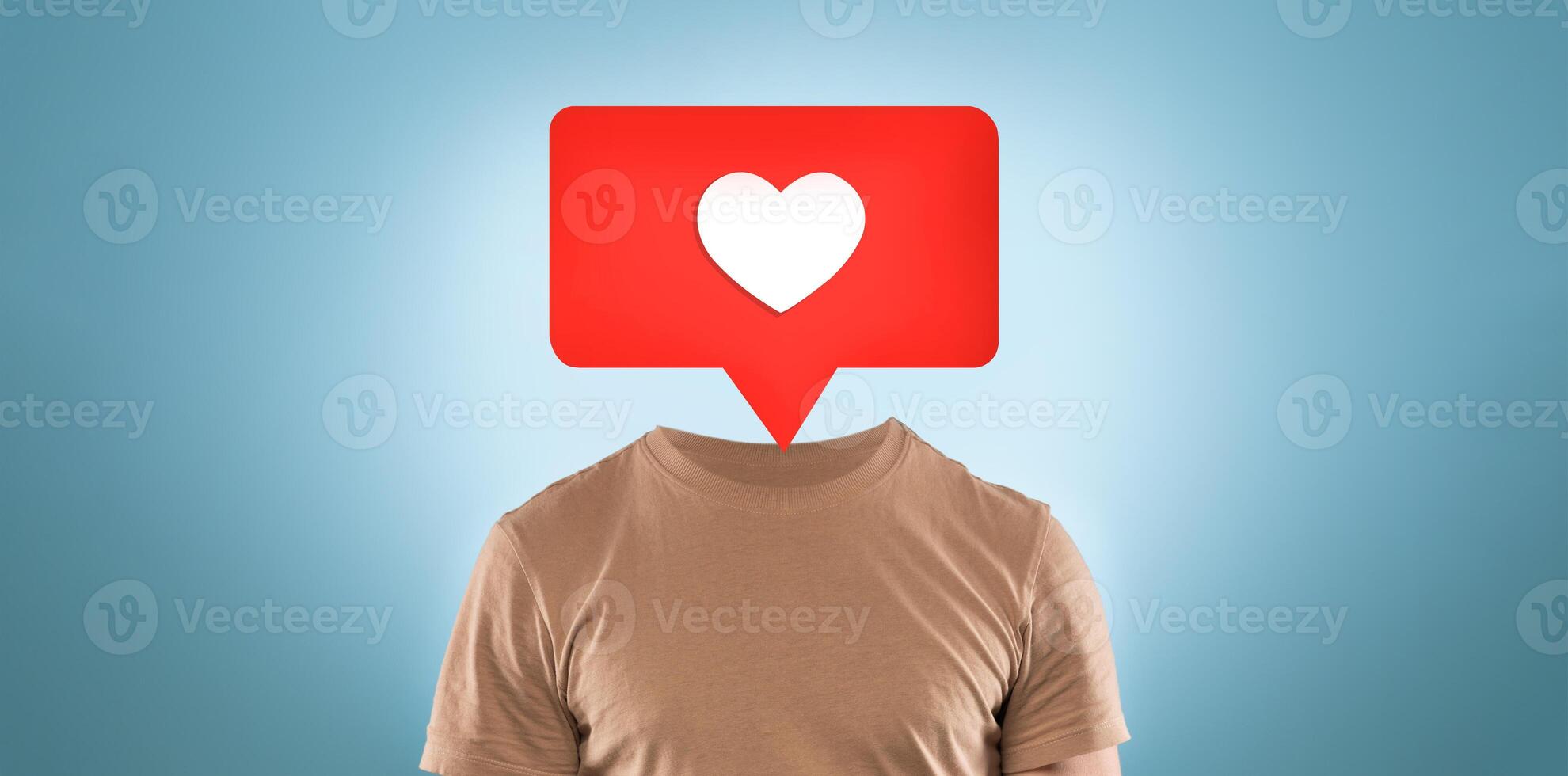 A creative representation shows a person without a head, replaced by a red speech bubble featuring a heart icon. This artwork conveys themes of social media interaction and emotional expression. photo