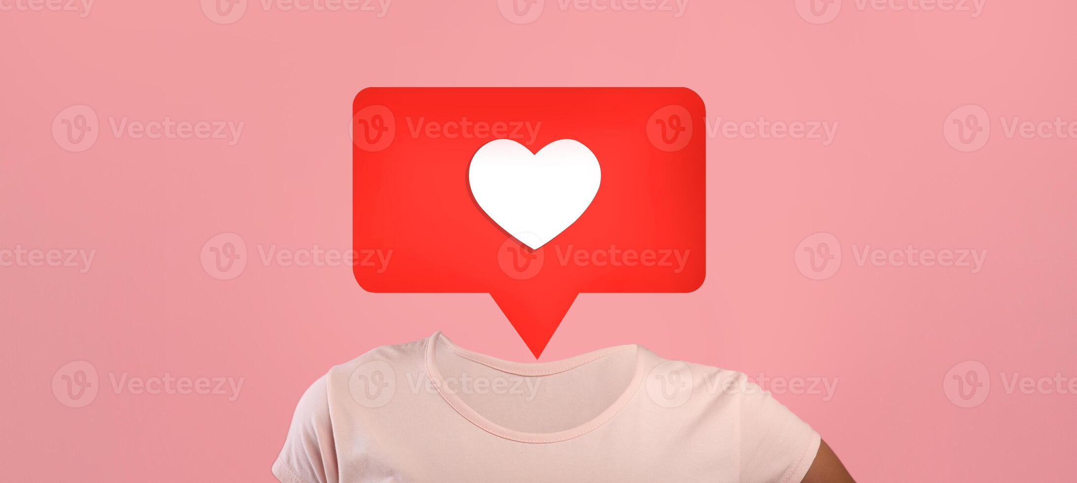 A unique design features a red heart icon inside a speech bubble over human body, using a pink background to symbolize social media interactions. photo