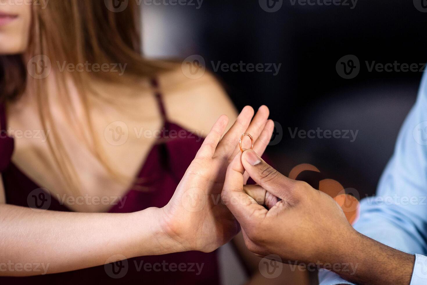 Woman rejecting marriage proposal from black boyfriend, refusing to take ring, saying no with open palm gesture. Young multiracial couple having relationship problems, cropped image, closeup photo