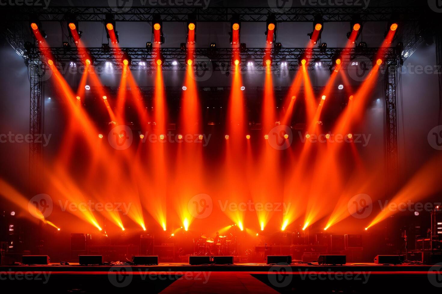 Red stage lights illuminating empty stage with instruments ready for music concert photo