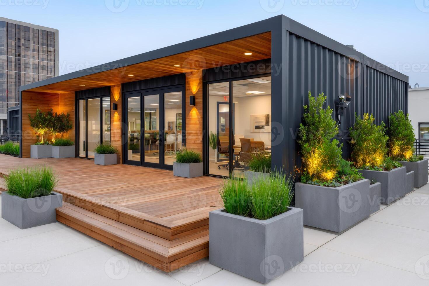 Modern office building made from shipping containers featuring wooden deck and landscaping photo