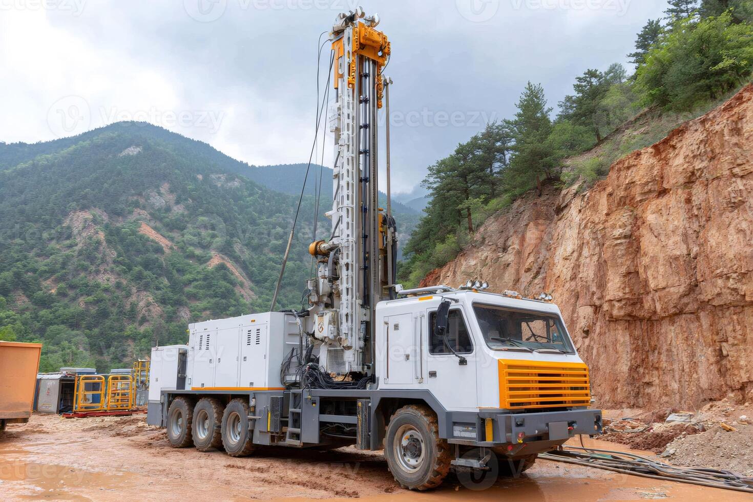 Mobile drilling rig exploring for resources in mountainous terrain photo