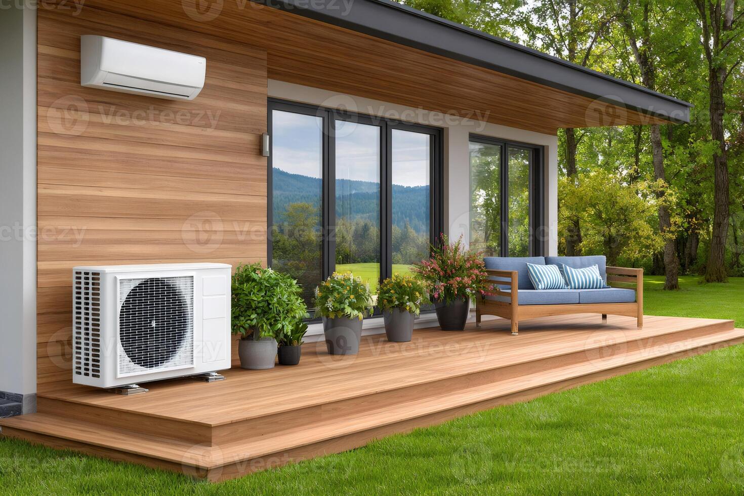 Air conditioner installed on wooden wall of modern house with patio photo