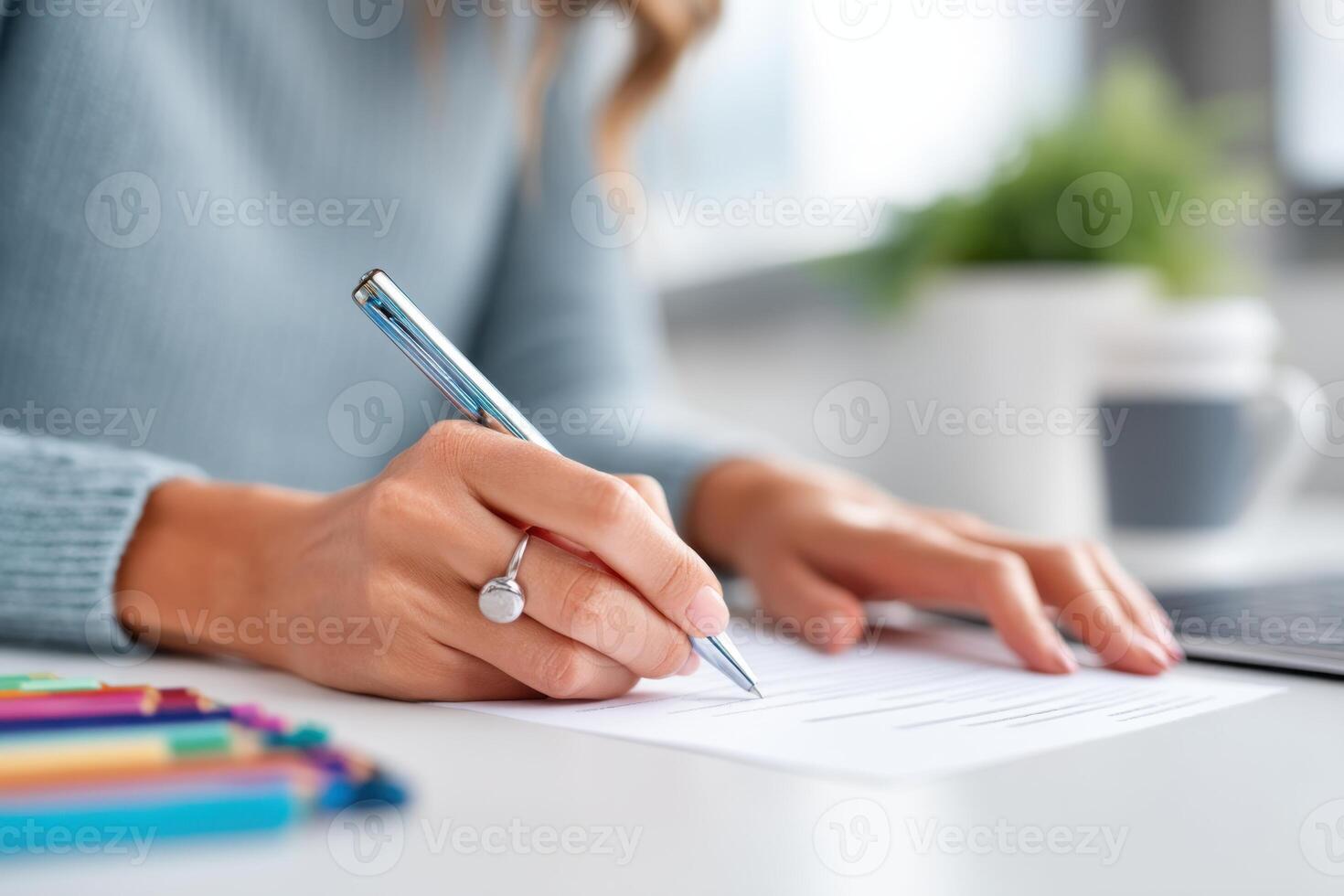 Updating a resume in a colorful workspace while navigating job search challenges photo