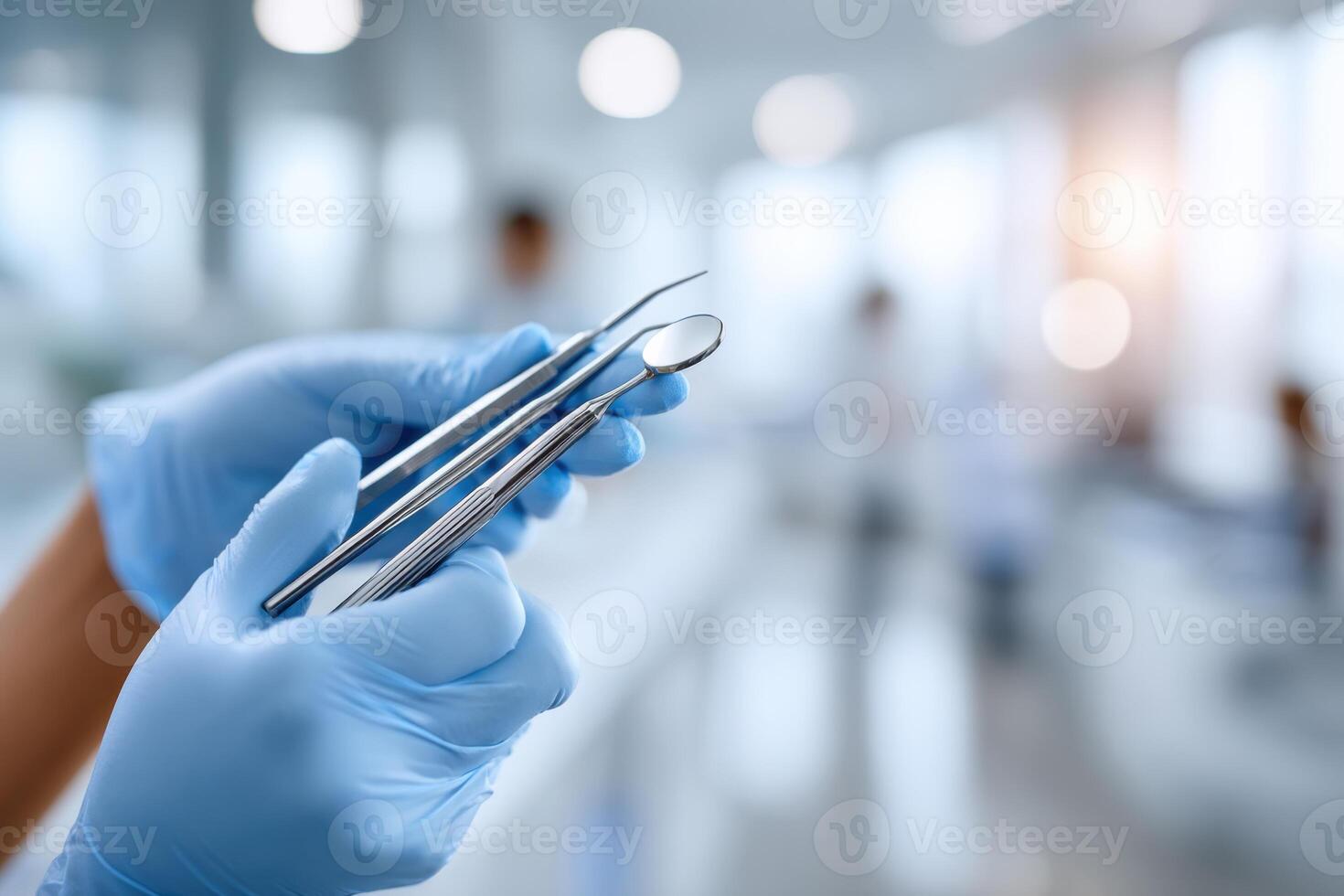 Close-up of dental tools in professional hands at a bright clinic emphasizing care and skill photo