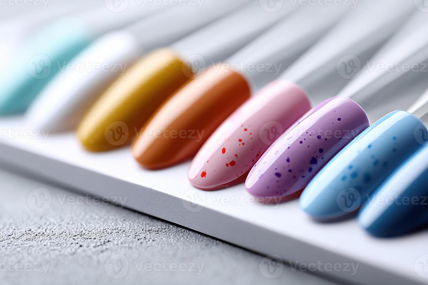Colorful false nail sets arranged in close-up showcasing vibrant splashes and unique designs photo