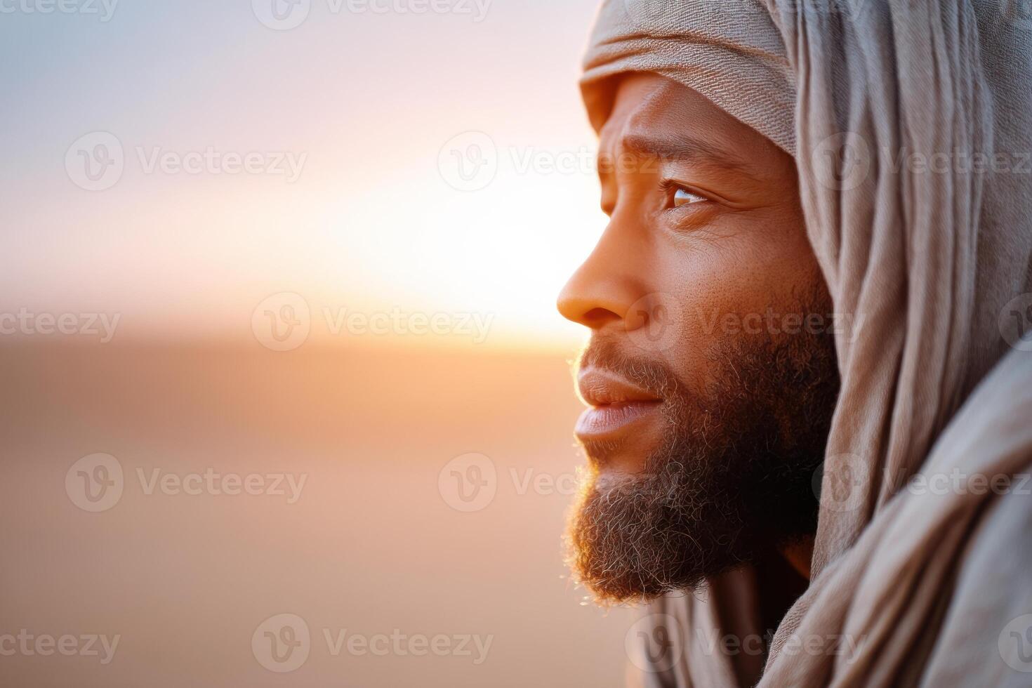 Prophet Ismail reflects on his trials in a vibrant desert landscape at sunset photo
