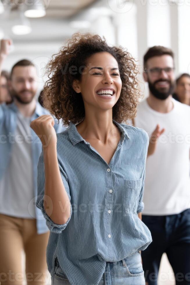 Diverse team celebrates small victories in a bright, collaborative workspace promoting encouragement and motivation photo