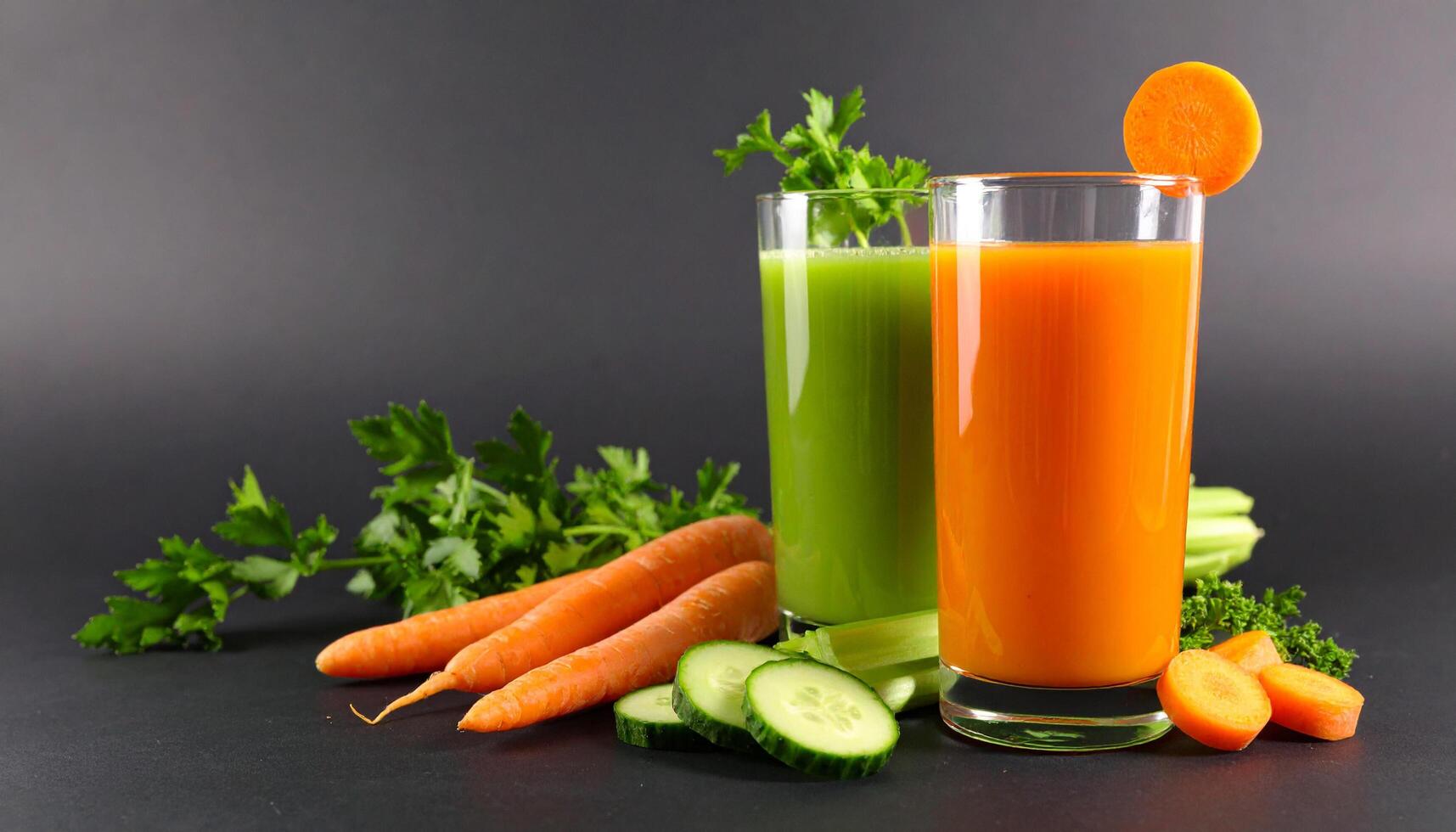 Freshly squeezed carrot juice and green vegetable juice for a healthy and nutritious start to the day photo