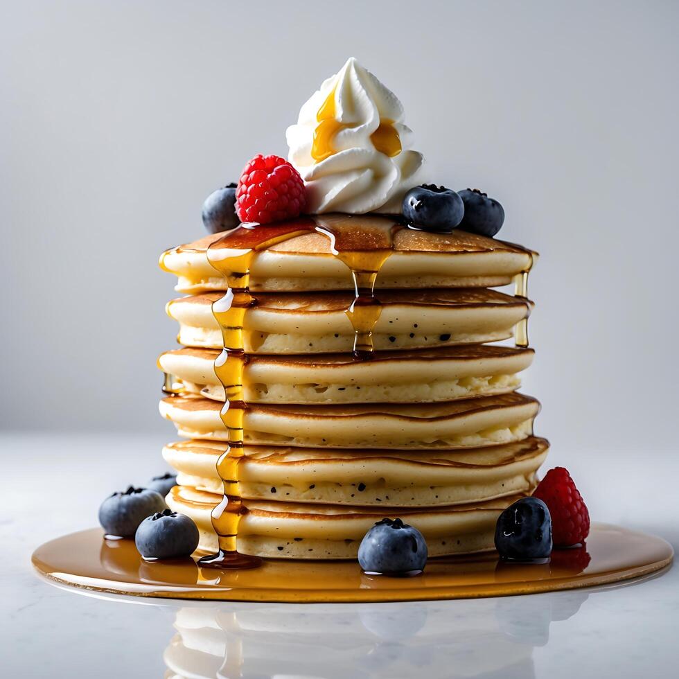 A Delicious Stack of Buttermilk Pancakes Topped with Whipped Cream, Berries, and Drizzled with Maple Syrup photo