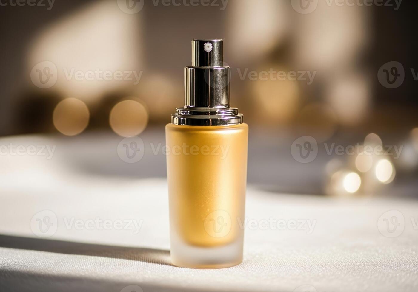 A bottle of golden liquid makeup sitting on a table photo