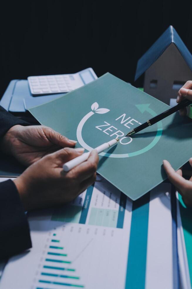 Business people holding paper with the word zero on it photo