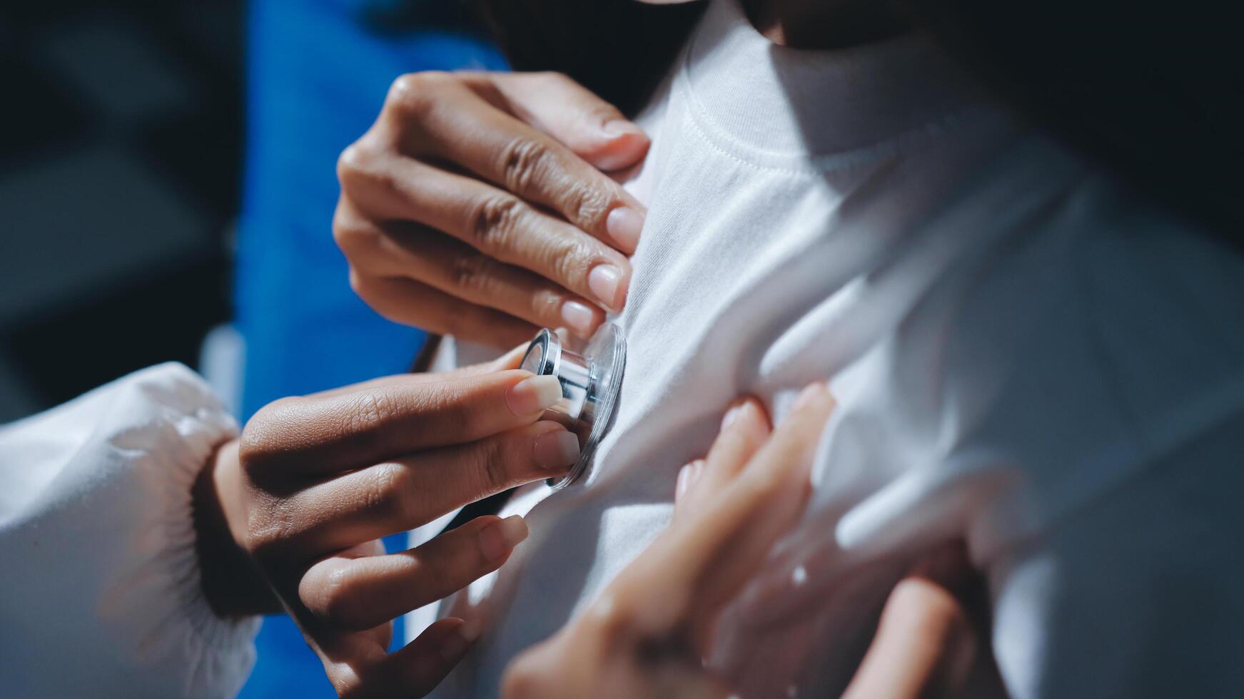 A person putting a pacemaker into someone's chest photo