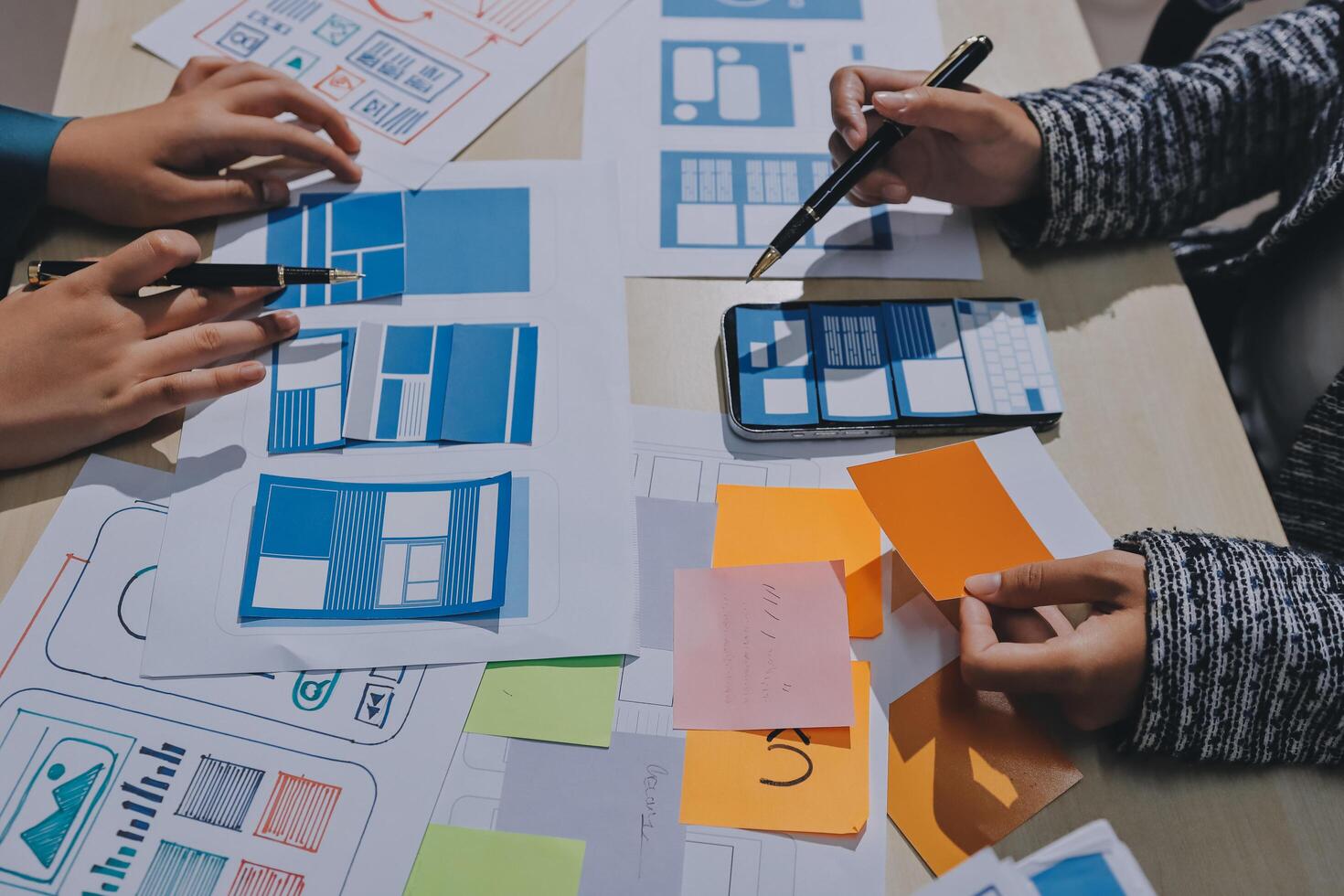 A group of people working on a website design photo