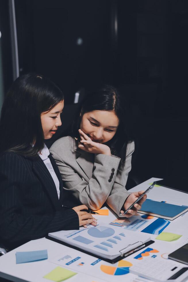 Two business women looking at a tablet computer photo