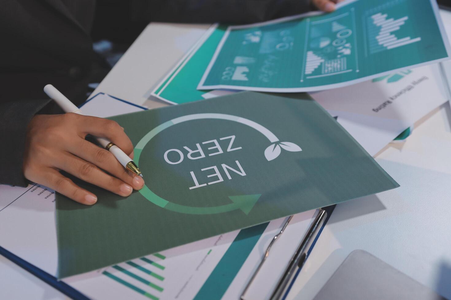Businessman writing on paper with zerolevel concept photo