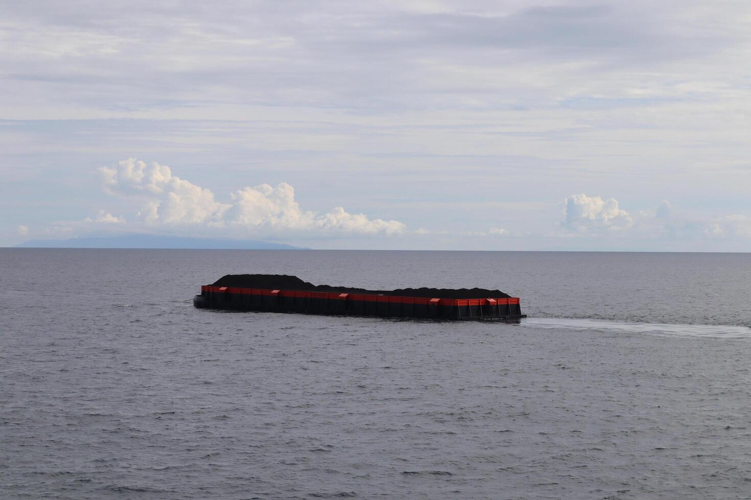 A large boat floating in the ocean photo