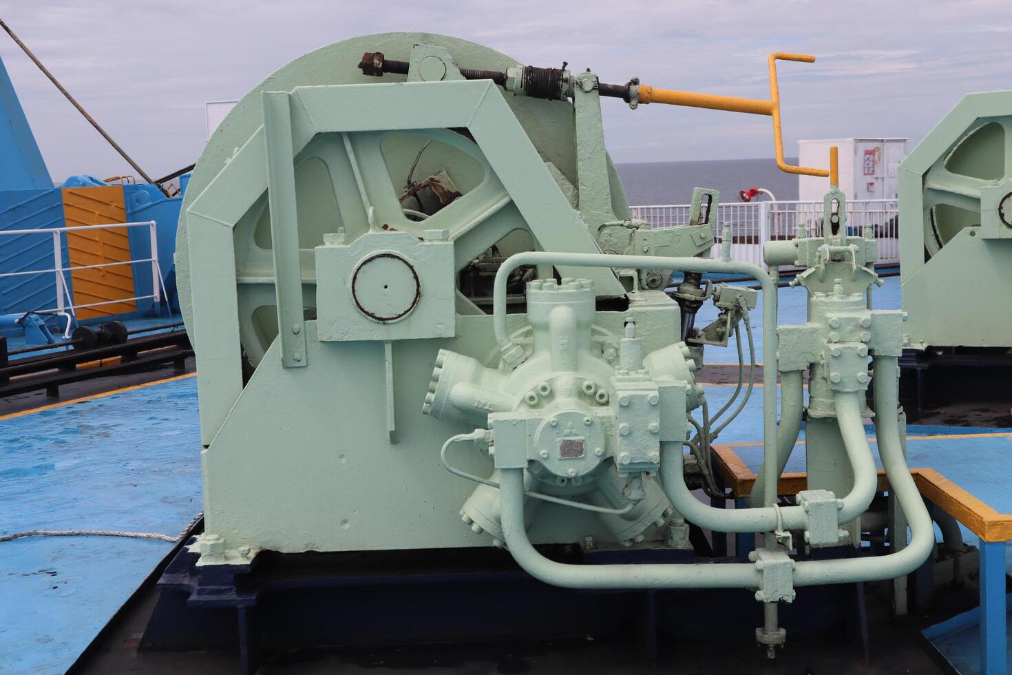 A large blue boat with a large engine on it photo