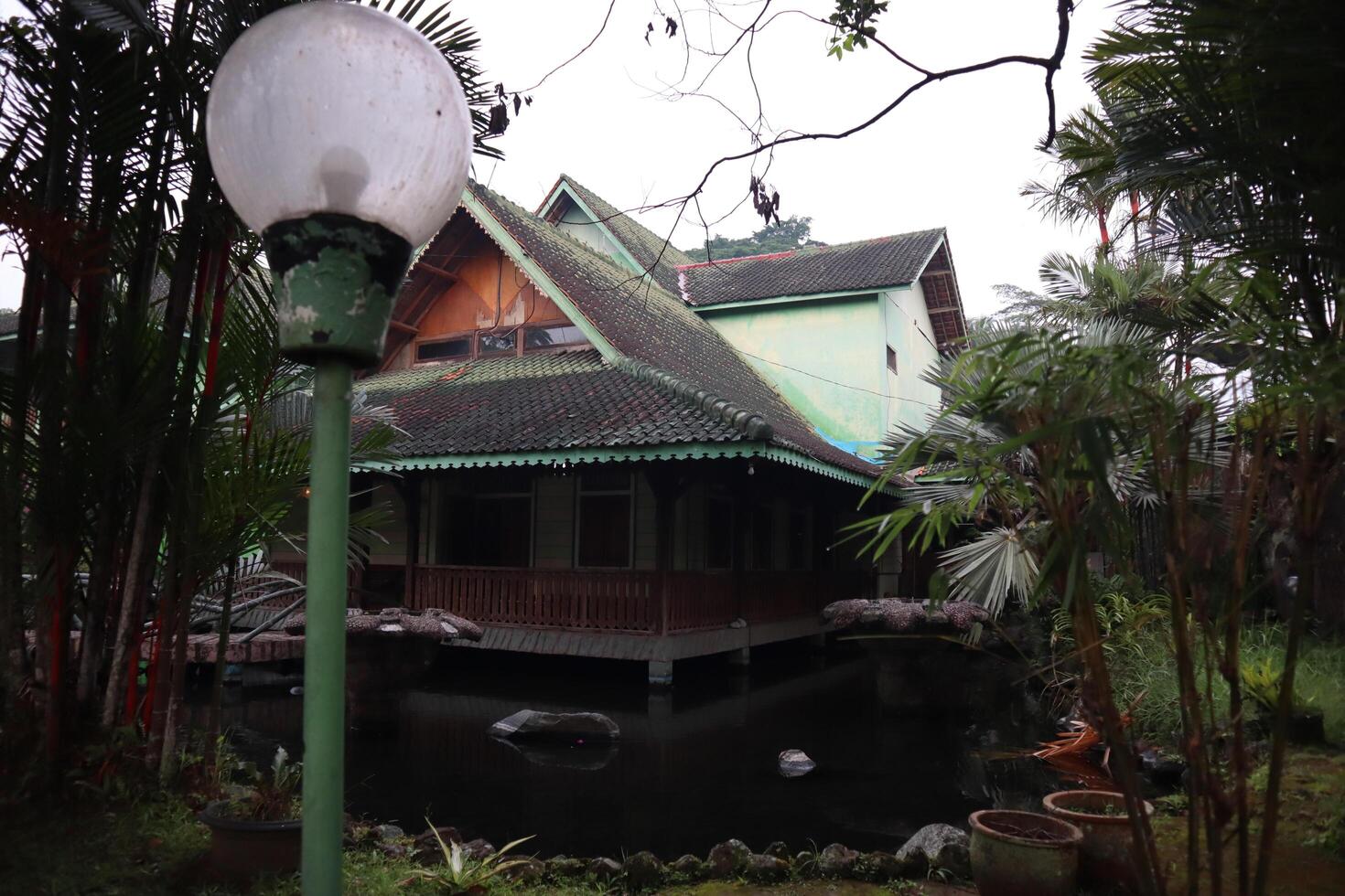 A house with a pond in front of it photo