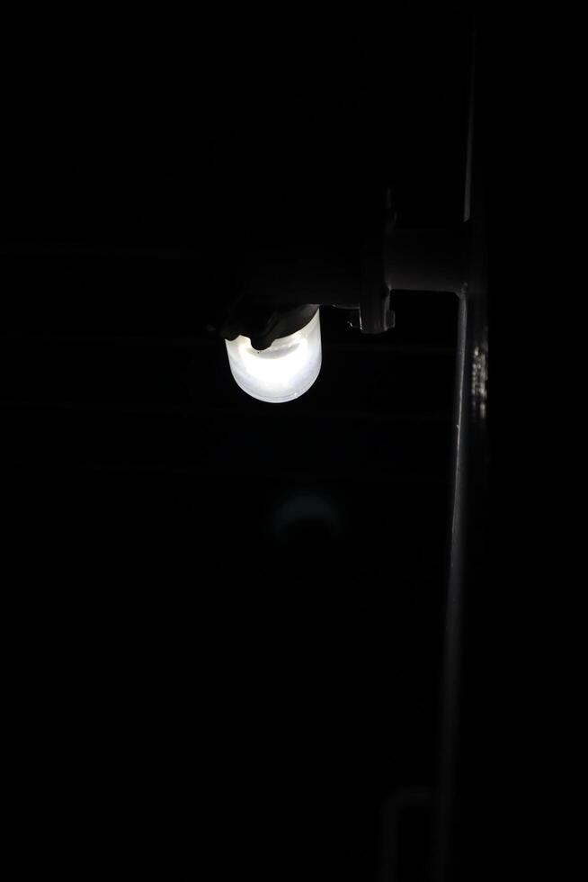 A light is shining on a light switch photo