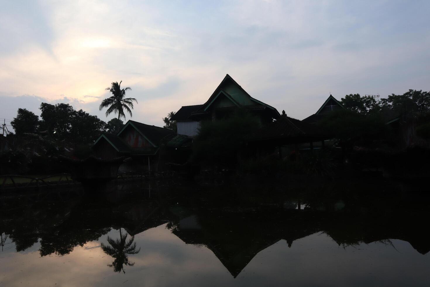 A reflection of a house in the water photo