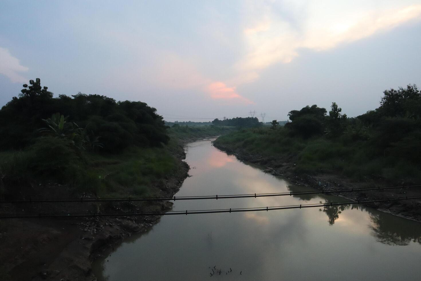 A river with a bridge over it photo
