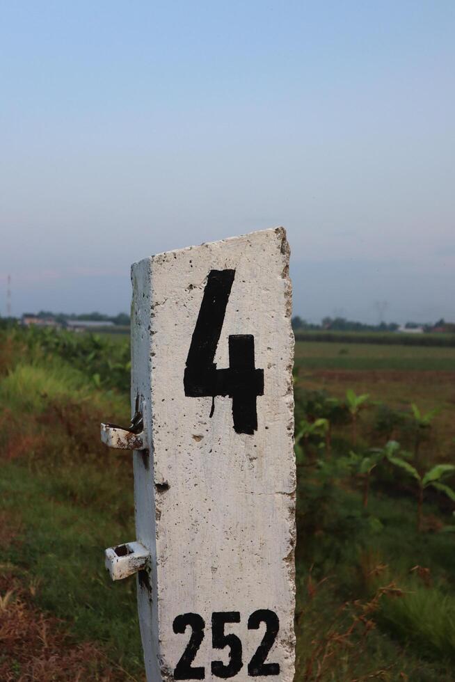A white sign with a number on it photo