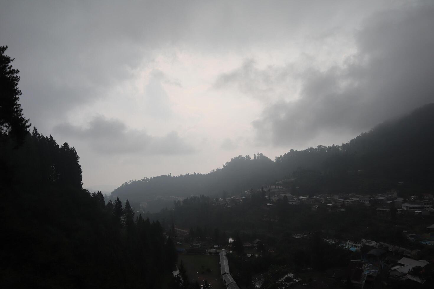 A cloudy sky over a mountain town photo