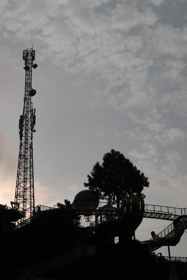 A large tower with a large crane on top photo