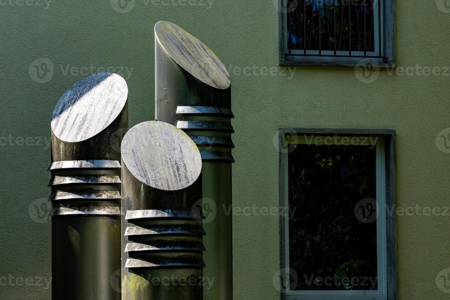 Modern ventilation system in the form of cylindrical sculptures photo