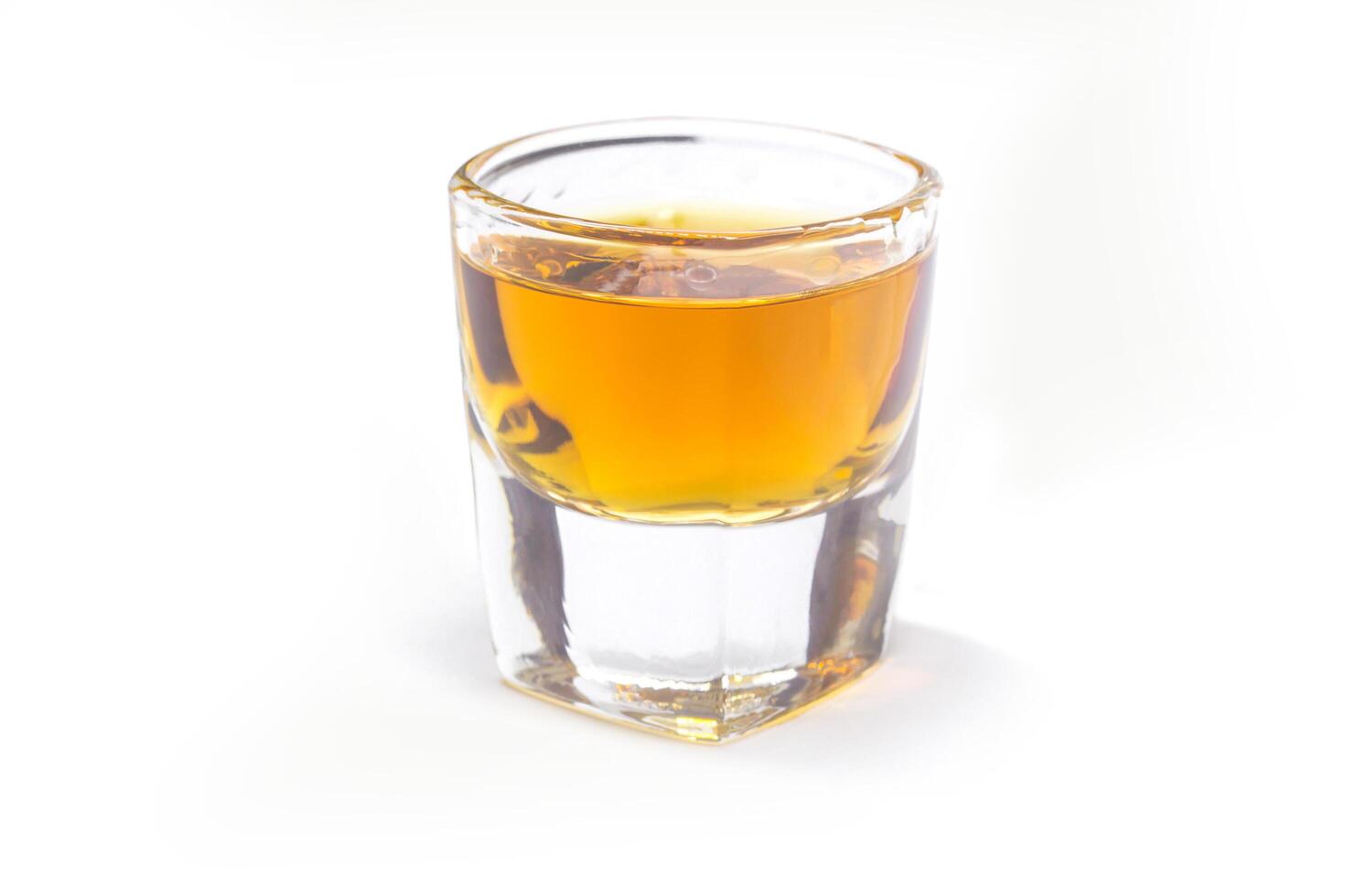Whiskey shot on white background photo