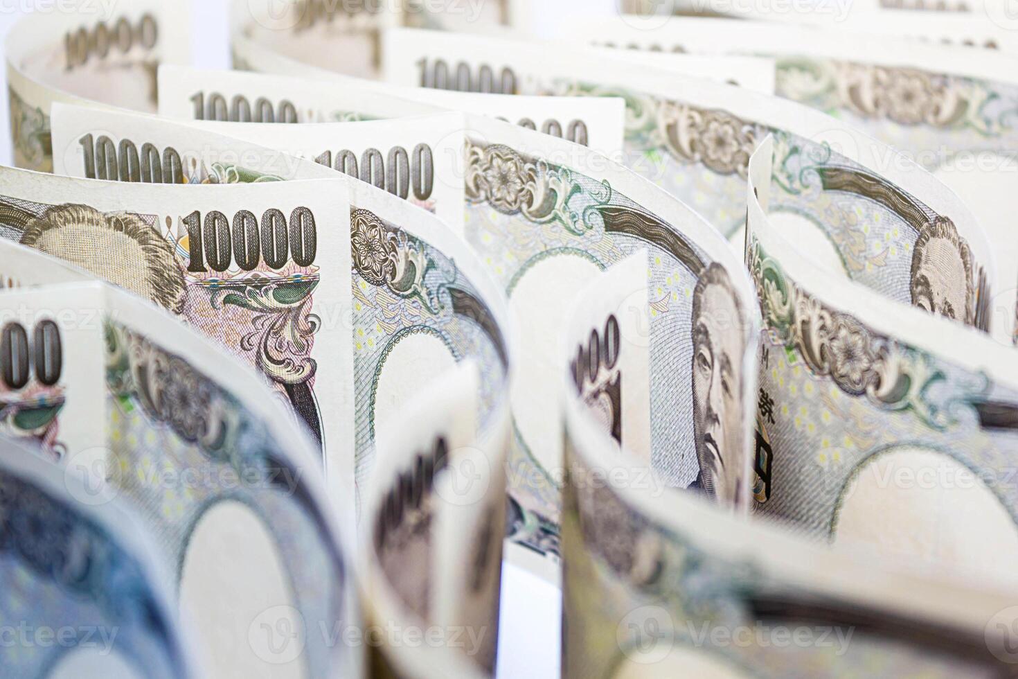 Wave Of Money Yen Banknote On White Background, Business And Finance Concepts, Banknotes Stacked On Each Other In Different Positions. photo