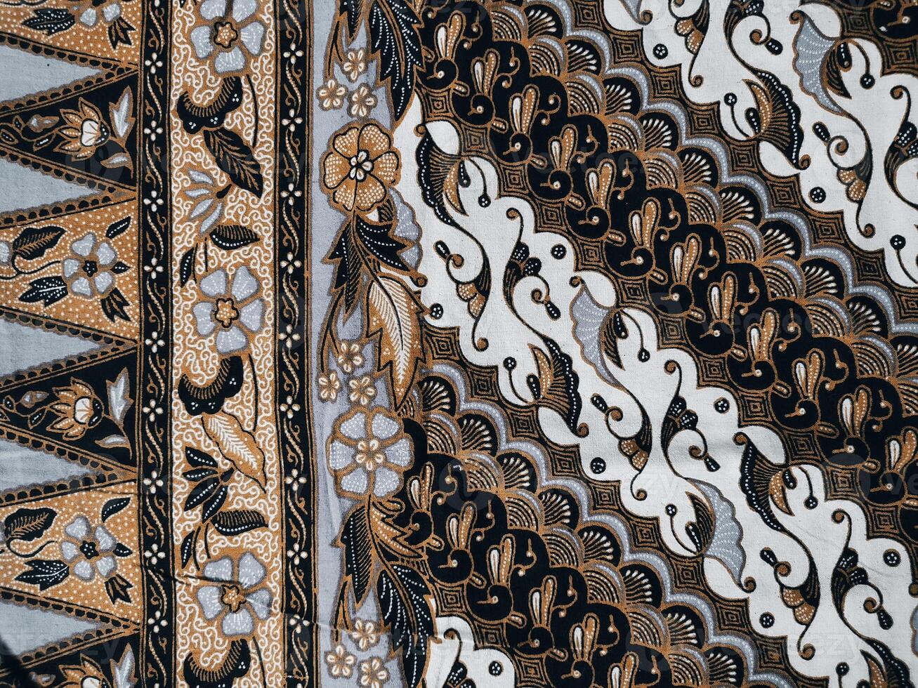 background pattern featuring motifs commonly found in Javanese batik. The pattern is symmetrical and abstract, and can be used on fabric, clothing, or wrapping paper designs. photo