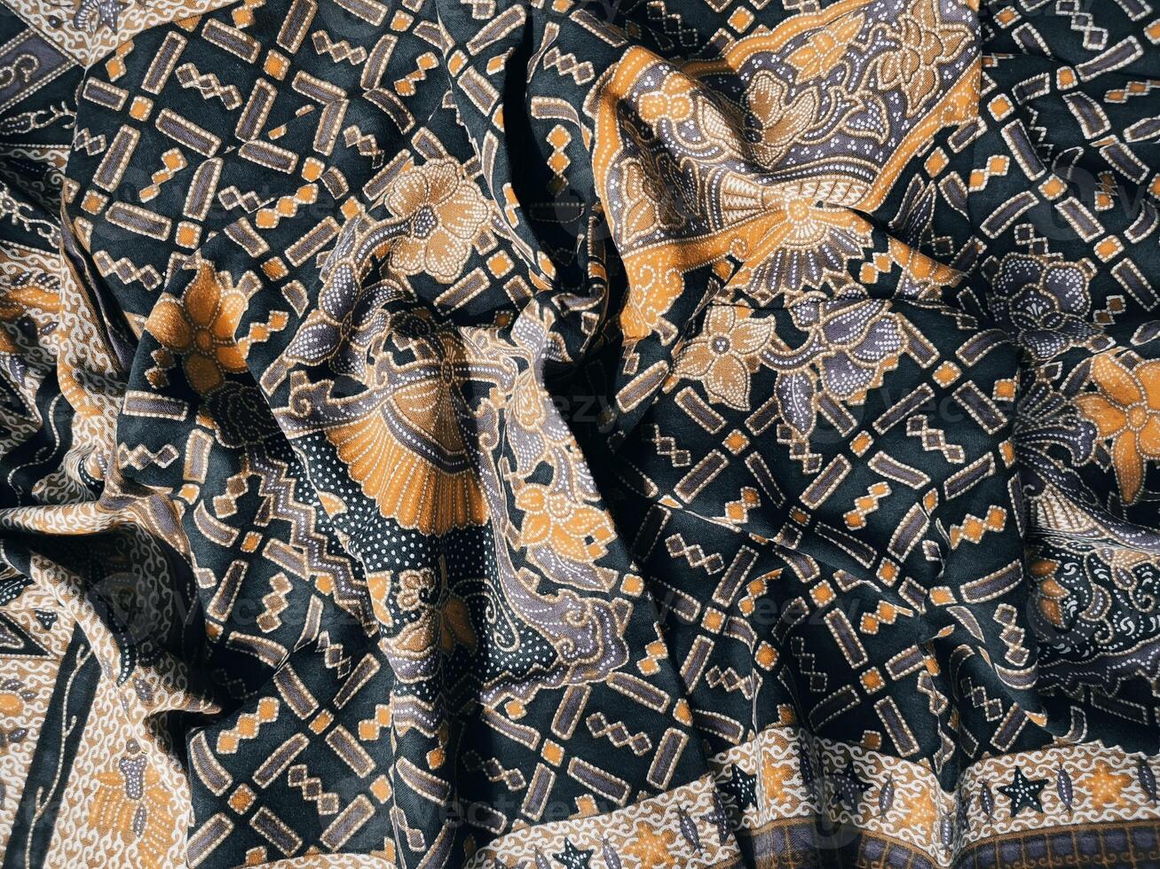 Black and yellow paisley print fabric photo